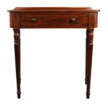 A George IV mahogany secretaire writing table, 1820s, inlaid with stringing, of breakfront outline,