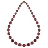 A 19th century gold foil back garnet rivière necklace