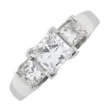 A platinum and diamond three-stone ring, by Garrard & Co.