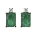 A pair of platinum emerald & diamond stud earrings