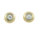 A pair of diamond stud earrings