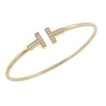 An 18ct gold and diamond 'Tiffany T' wire cuff bangle, by Tiffany & Co.