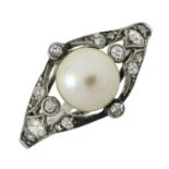 An early to mid 20th century platinum, pearl and diamond ring