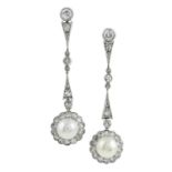 A pair of pearl and diamond earrings