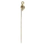 A late 19th century treble clef stickpin