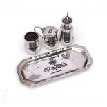 An early 20th Century Egyptian silver and niello cruet set, comprising of pepper pot, mustard and
