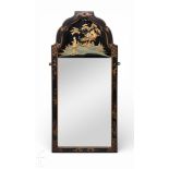 A 1930s Japanese chinoiserie lacquered mirror, the reverse painted panel depicting a figure in a