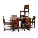 A 17th Century style oak draw leaf refectory dining table on large turned pedestal supports and