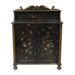 William IV decorative ebonised lacquer chiffonier, the raised shelf with scroll cresting, above a