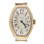 Early Patek Philippe 14ct tonneau curved gentleman's wristwatch, circa 1920s, signed silvered dial