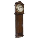 Large oak single train trunk wall clock, 12" circular painted dial inscribed 'B.R.W' (British