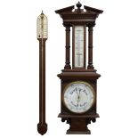 Carved oak aneroid barometer, the ornate case with broken arched pediment and fluted columns,