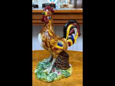 A Large Majestic Portugese Majolica Pottery Cockerel figure, decorated with vibrant plumage,standing
