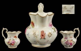 An unusual antique Derby or Rockingham floral decorated Masonic Jug, with spring flowers finely