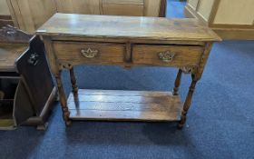 Golden Oak Country Style Side Table, two drawers, turned supports and shelf. Measures 28'' high x