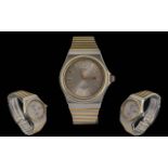 Seiko Sports 100 Gents Stainless Steel and Gold Tone Quartz Day-Date Display Wrist Watch. Features