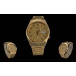 Seiko 5 Gents Automatic Day-Date Gold on Steel Wrist Watch. Features Champagne Dial, Gold Markers,