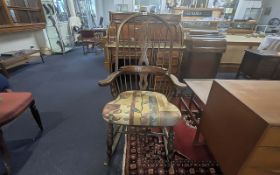 20th Century Windsor Rocking Chair, upholstered seat. Measures 46'' high x 25'' widest point.