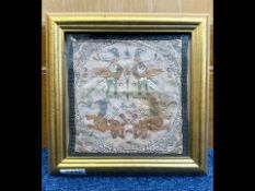 Antique Textile Fragment depicting stylised Griffins, framed and glazed. 10'' square overall.