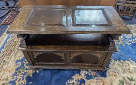 Early 20th Century Jacobean Style Oak Panelled Monks Bench, typical form, carved arm rests and