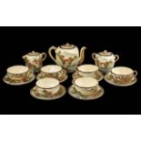 A Fine Quality Meiji Period Satsuma Pottery Tea Set, consisting of six cups and saucers, teapot,