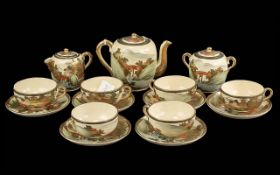 A Fine Quality Meiji Period Satsuma Pottery Tea Set, consisting of six cups and saucers, teapot,