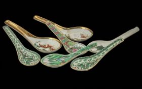 Eleven Antique Chinese Decorated Soup Spoons.