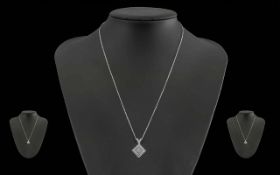 Ladies Pleasing 18ct White Gold Diamond Set Pendant Attached to a 18ct White Gold Chain. Both Marked
