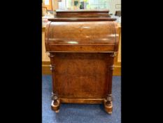 Victorian Walnut Davenport of typical form, fitted interior. Four side drawers and four dummy