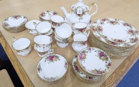 Royal Albert 'Old Country Rose' Tea/Dinner Services, comprising a teapot, milk jug and sugar bowl,