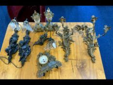 Pair of Figural Carved Cherub Wall Lights, together with a pair of gilt metal three branch rococo