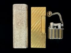 Cartier Paris Silver Lighter, serial No. F15273, together with a Dunhill lighter, and a small