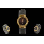 Gucci Ladies Gold Plated Quartz Wrist Watch with Original Watch Strap. Features Black Dial, Gold