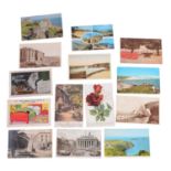 Eleven boxes of postcards, stamps, folders, and printed images from books.