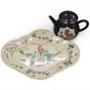 A Chinese famille rose lobed oval dish and a restored blue glazed teapot, dish 27cm