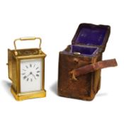 A French brass carriage clock with gong-striking movement, with key, in original leather case