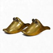 A pair of Spanish colonial engraved brass stirrups, 28cm
