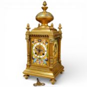 A late 19th century French brass and champlevé enamel mantel clock, with gong-striking movement,