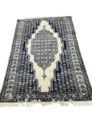 A Turkish ivory ground rug, 180 x 120cm