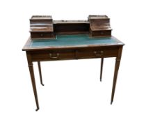 An Edwardian satinwood banded mahogany writing table, bears Maple & Co. label, width 91cm, depth