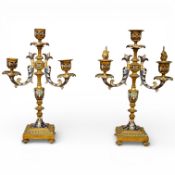 A pair of late 19th century French brass and champlevé enamel candelabra, 29cm