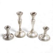 Two pairs of Elizabeth II silver mounted candlesticks, 20.3cm, dwarf pair 9.9cm, Adie Brothers,