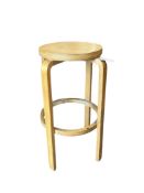 An Alvar Aalto style birch ply stool, height 69cm
