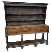 An 18th century oak pot board dresser with boarded rack, width 185cm, depth 42cm, height 187cm
