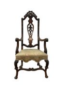 An Anglo-Dutch carved walnut high back elbow chair, in early 18th century style, width 62cm,