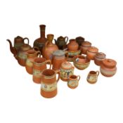A group of Victorian Watcombe and Torquay terracotta vessels, some with enamelled detail, possibly