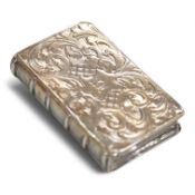 An early Victorian silver rectangular vinaigrette, modelled a book, with engraved decoration(tired),