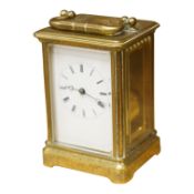 A late 19th century French engraved brass eight-day carriage clock, striking hours and half-hours on