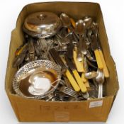 A large quantity of assorted plated cutlery and other plated ware