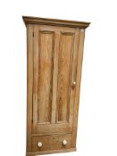 A narrow Victorian pine wardrobe, width 88cm, depth 46cm, height 198cm
